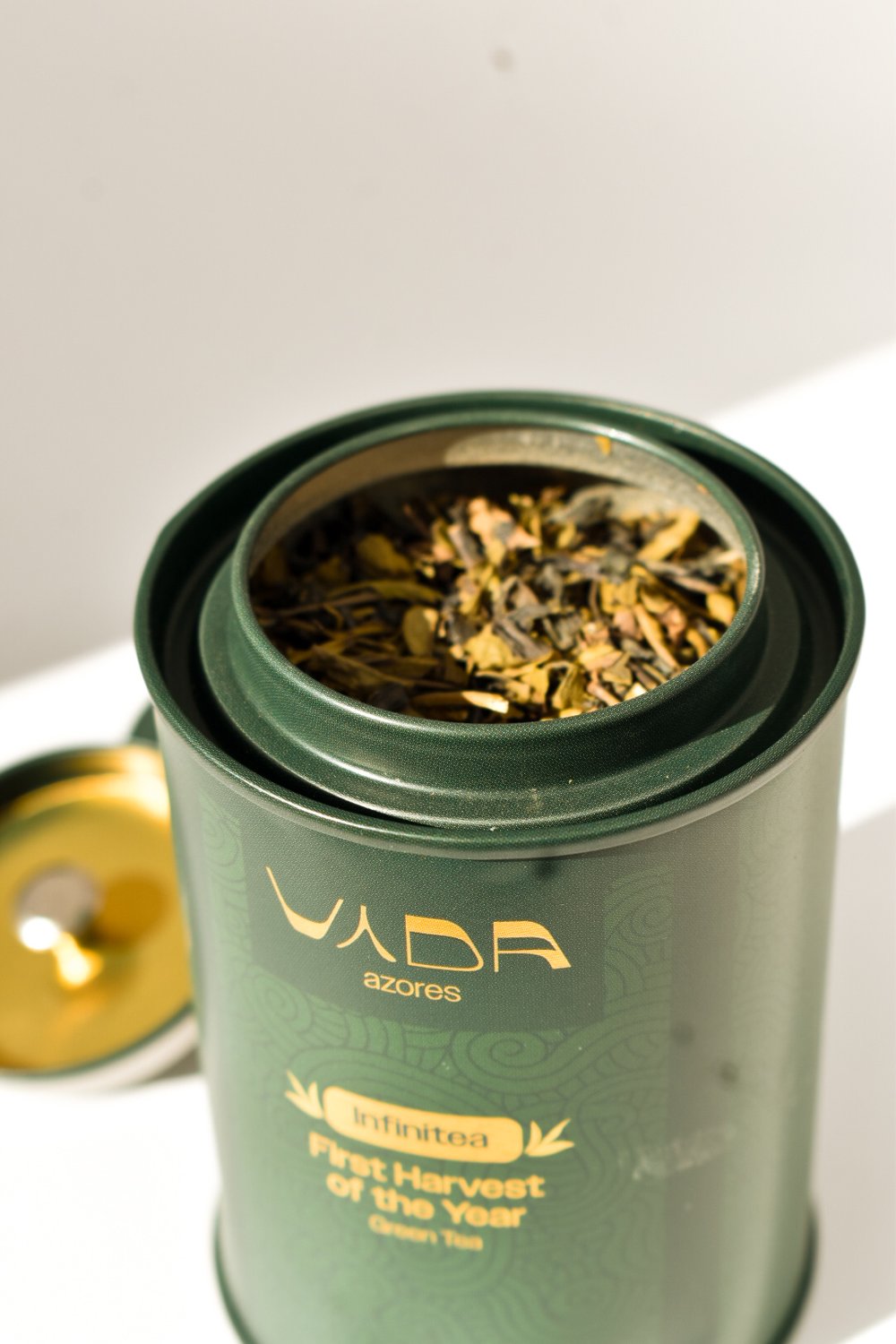 Open tin with gold lid